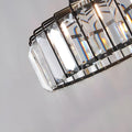 Close-up of K9 crystal panels on modern pendant light showing clarity and metal detailing