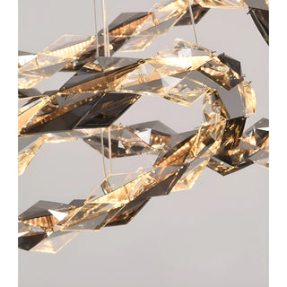 Detailed view of faceted K9 crystal elements reflecting warm LED light