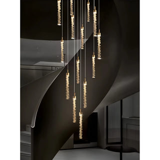 Kaelix crystal cascade staircase chandelier installed in a modern luxury foyer with adjustable hanging pendant lights