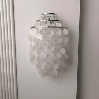 Large chrome Capiz Shell Wall Sconce featuring handcrafted capiz shell discs and a tiered metal frame mounted on a wall