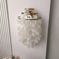 Large gold Capiz Shell Wall Sconce with cascading natural shell discs mounted on a wall in a modern interior