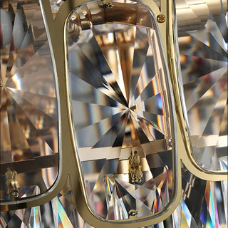 Detail view of the metal arms and crystal pendants of the Roure chandelier