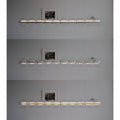 Glass pendant light displaying three brightness levels for versatile ambiance