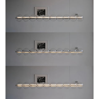 Glass pendant light displaying three brightness levels for versatile ambiance