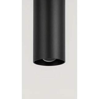 Detailed front view of cylindrical LED sconce with black reflector for directional beam