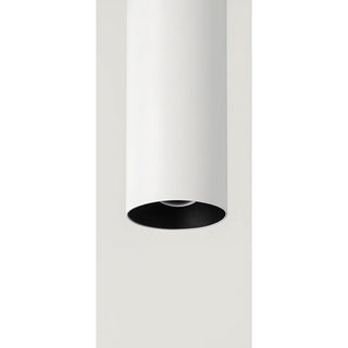 Minimalist cylindrical LED wall light in matte white finish with contrasting black interior reflector