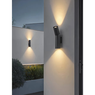 Sleek black dual-beam LED wall light with upward and downward illumination, installed on modern outdoor wall
