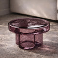 Low profile purple glass coffee table with thick round top