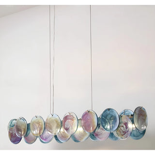 Rectangular Lumière Éclat chandelier in Ocean Blue finish featuring hand-textured glass discs with soft gradient tones