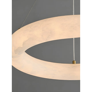 Luxury alabaster ring pendant light with brass frame, highlighting smooth handcrafted stone finish