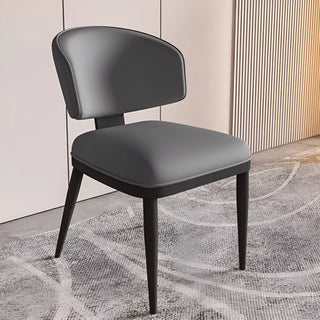 Luxury dining chair in dark gray with backrest and black legs for modern interiors