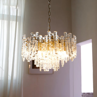 Luxury Murano glass chandelier glowing in a sophisticated contemporary interior setting
