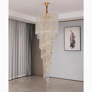 Long cascading gold chandelier with sparkling crystals for staircase