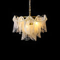 Luxury tiered glass chandelier with gold hardware on black background