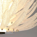 Detailed view of handcrafted textured crystal leaf elements on the Lysara luxury chandelier