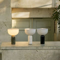 Cordless rechargeable marble table lamps in three color options with marble bases