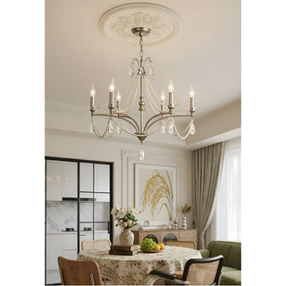 Marcelline Pearl French candle crystal chandelier above a dining table in a bright elegant dining room