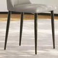 Sturdy tapered metal legs with a matte black finish, designed for stability and elegance