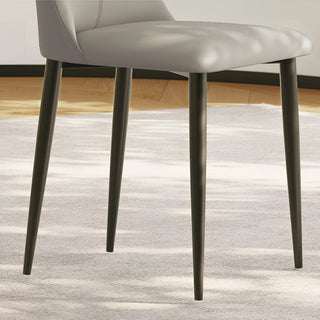 Sturdy tapered metal legs with a matte black finish, designed for stability and elegance