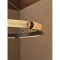 Close-up detail of the Milano Halo Ring Pendant Light featuring a ribbed LED diffuser and black metal frame