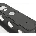 Close-up top view of minimalist LED wall light in matte black finish showing six-beam lens detail and mounting points