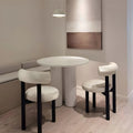 Minimalist upholstered chairs styled in a cozy modern dining corner