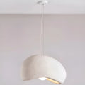 minimalist single pendant lamp with a white textured shade and curved organic shape hanging from the ceiling, modern wabi-sabi lighting design