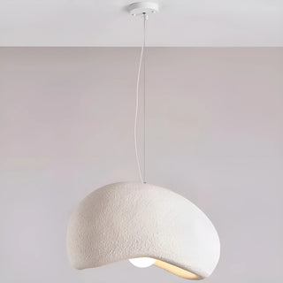 minimalist single pendant lamp with a white textured shade and curved organic shape hanging from the ceiling, modern wabi-sabi lighting design