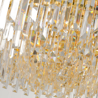 Stainless steel frame and crystal detail of a gold empire chandelier