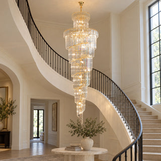Cap d'Ail crystal staircase chandelier in a curved foyer with a grand staircase