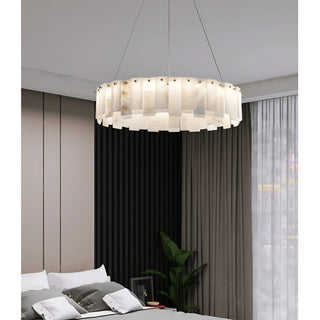 Mirodemi Cloudstone Marble chandelier illuminating a modern bedroom with soft warm light
