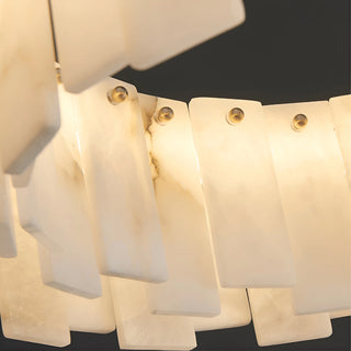 Handcrafted marble chandelier from Mirodemi with warm ambient glow and golden copper hardware
