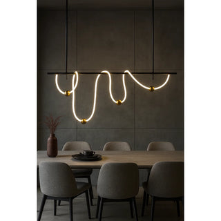 Contemporary MIRODEMI linear LED pendant light with sculptural silicone lines and brass details hanging above a neutral gray dining space