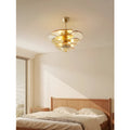 Mirodemi Lunaria layered glass disc chandelier in amber glass styling a warm sunlit bedroom