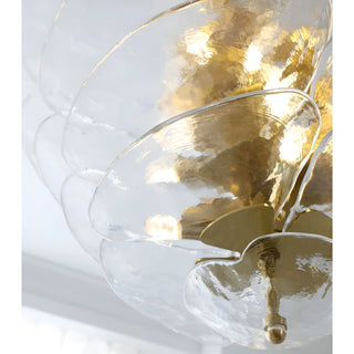 Close-up detail of the Mirodemi Lunaria layered clear glass disc chandelier with polished brass hardware