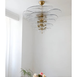 Mirodemi Lunaria layered clear glass disc chandelier with brushed brass hardware in an airy white interior