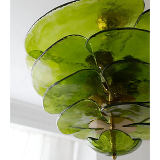 Close-up detail of the Mirodemi Lunaria layered green glass disc chandelier with brass hardware
