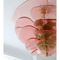 Close-up detail of the Mirodemi Lunaria layered pink glass disc chandelier with brass hardware