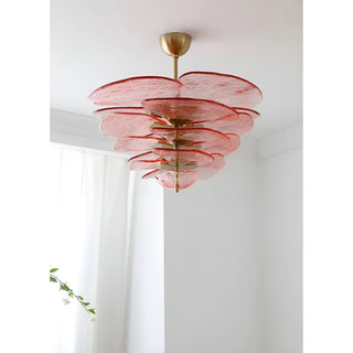 Mirodemi Lunaria layered glass disc chandelier in pink glass with brass hardware in a bright white room