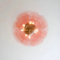 Top view of the Mirodemi Lunaria layered glass disc chandelier in pink glass on a white ceiling