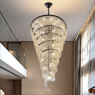Long black chandelier for a staircase