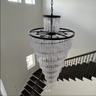 Metal and crystal chandelier in black for a staircase