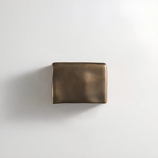 Bronze rectangular outdoor light on a light gray background
