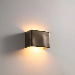 Modern wall-mounted light fixture on a neutral background
