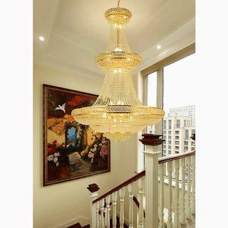 Hanging three-tier gold crystal chandelier with cascading crystals