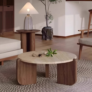 MIRODEMI travertine coffee table with walnut wood base styled next to a designer lamp in a cozy contemporary lounge