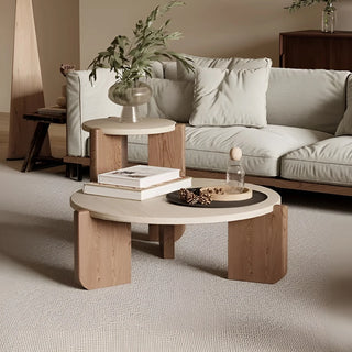 MIRODEMI nesting travertine coffee tables with light stone tops and wooden bases, styled in a Scandinavian-inspired living room