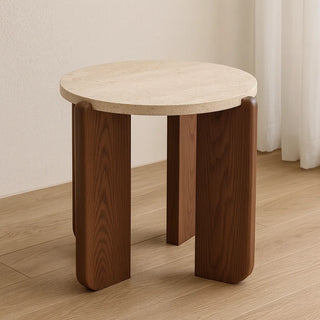Close-up of MIRODEMI travertine side table featuring a natural stone top and solid walnut curved base on wooden floor