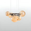 Close-up of amber glass globe chandelier with warm LED bulbs and circular metal structure