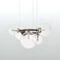 Detail of clear glass globe chandelier showing LED bulb inside transparent glass sphere